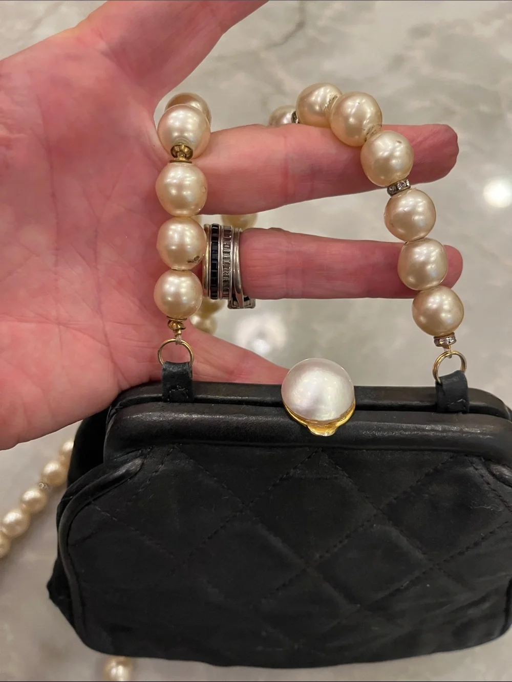 Black Satin Authentic Chanel Evening Bag with faux pearl strap.